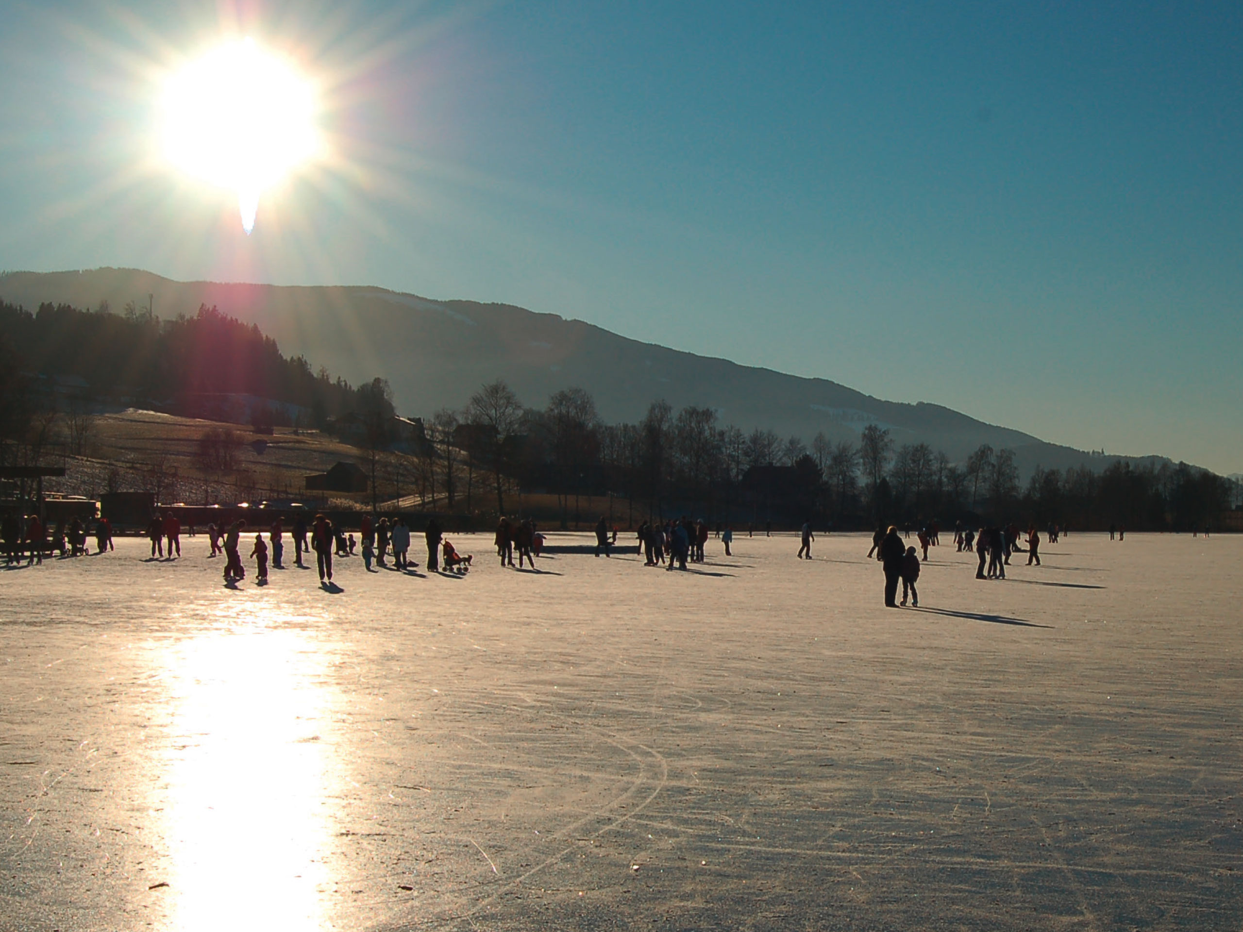 Frozen Alpine lake in winter near Aigen im Ennstal, Styria